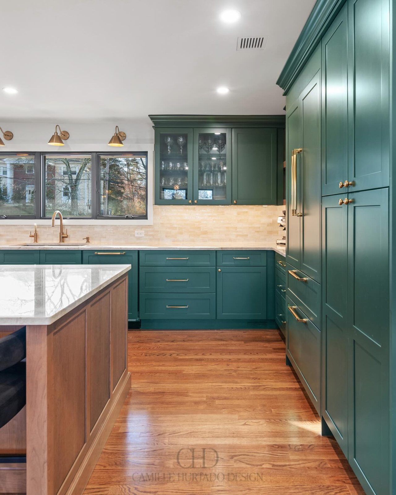Green kitchen full view with glass cabinets