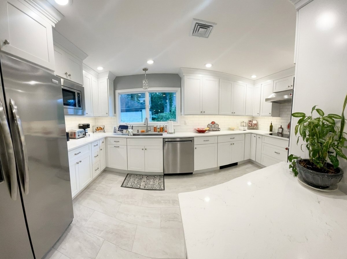 White kitchen with gray tile floors