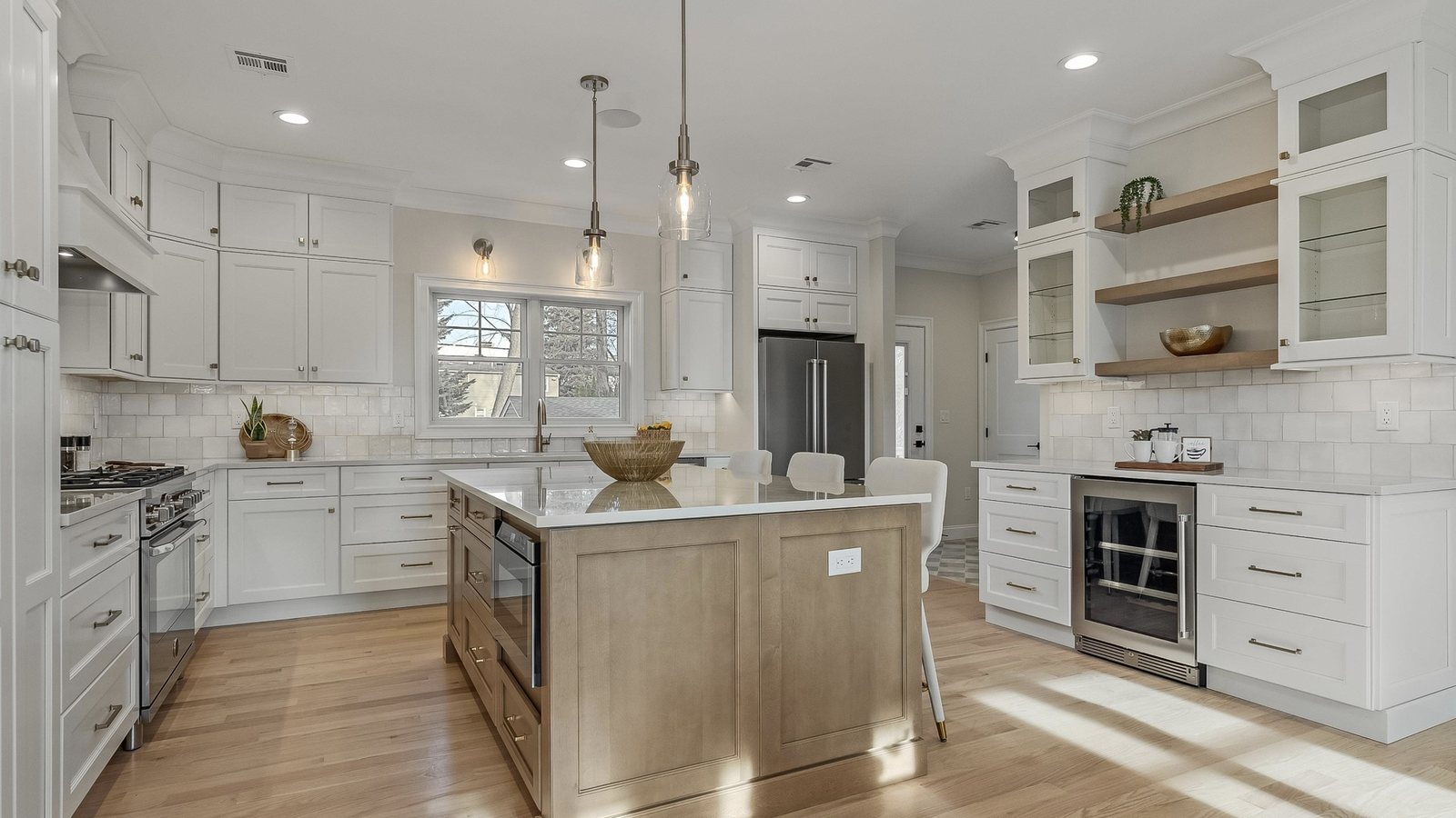 Delivered kitchen with island and beverage wall